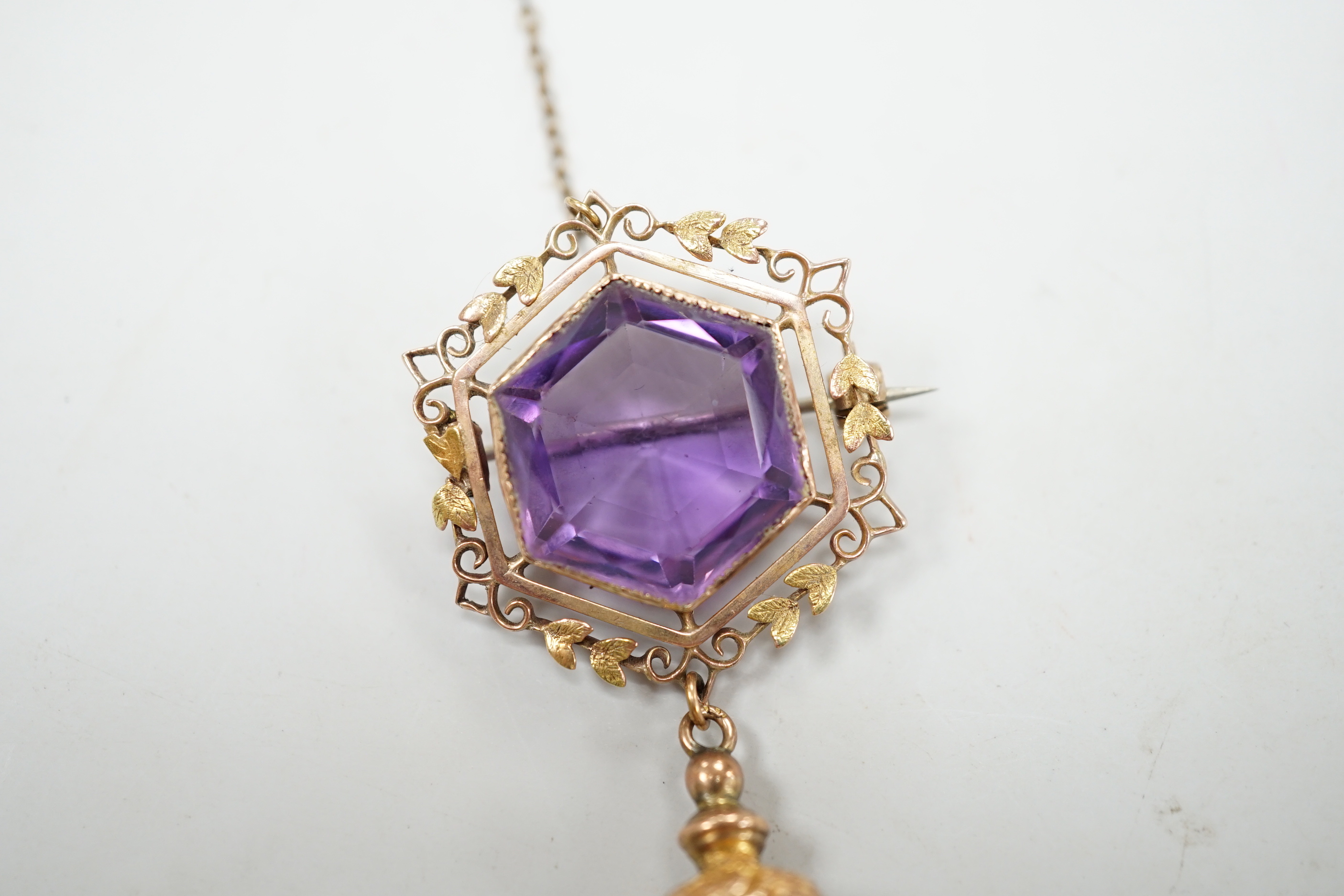 An Edwardian 9ct and hexagonal cut amethyst set tassel drop brooch, overall 75mm, gross weight 10.7 grams.